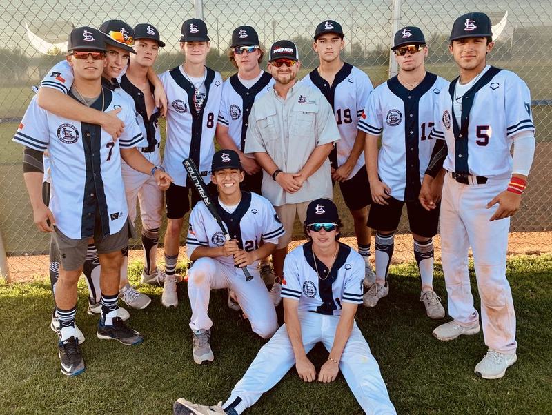 A Windmill team in white jerseys on the field